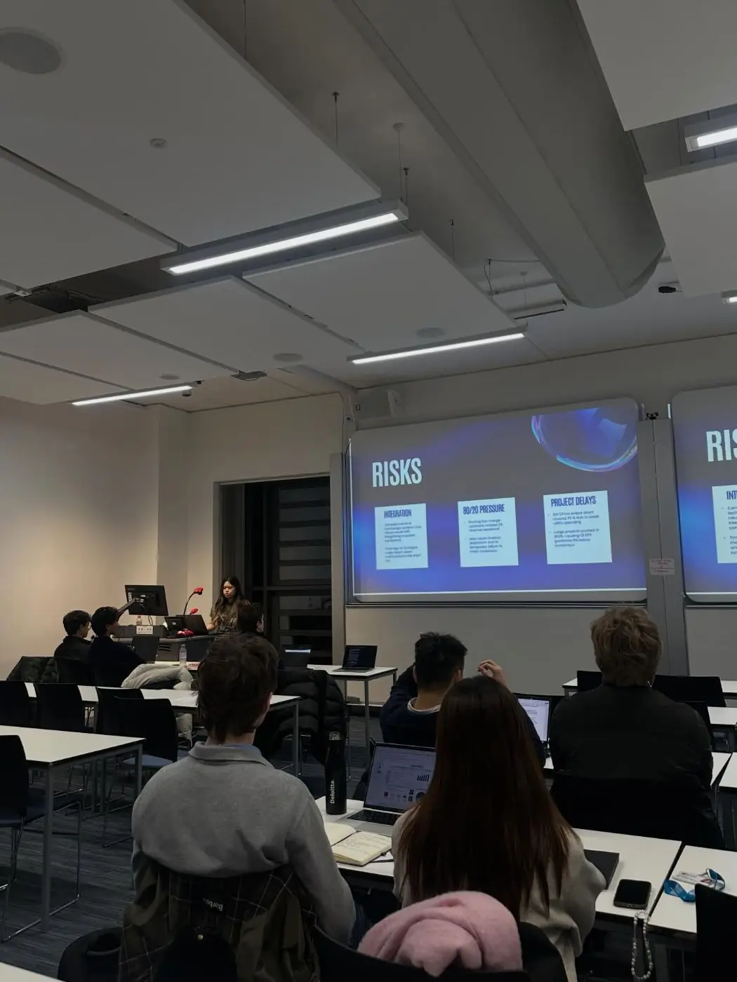 Members watching a presentation on risks