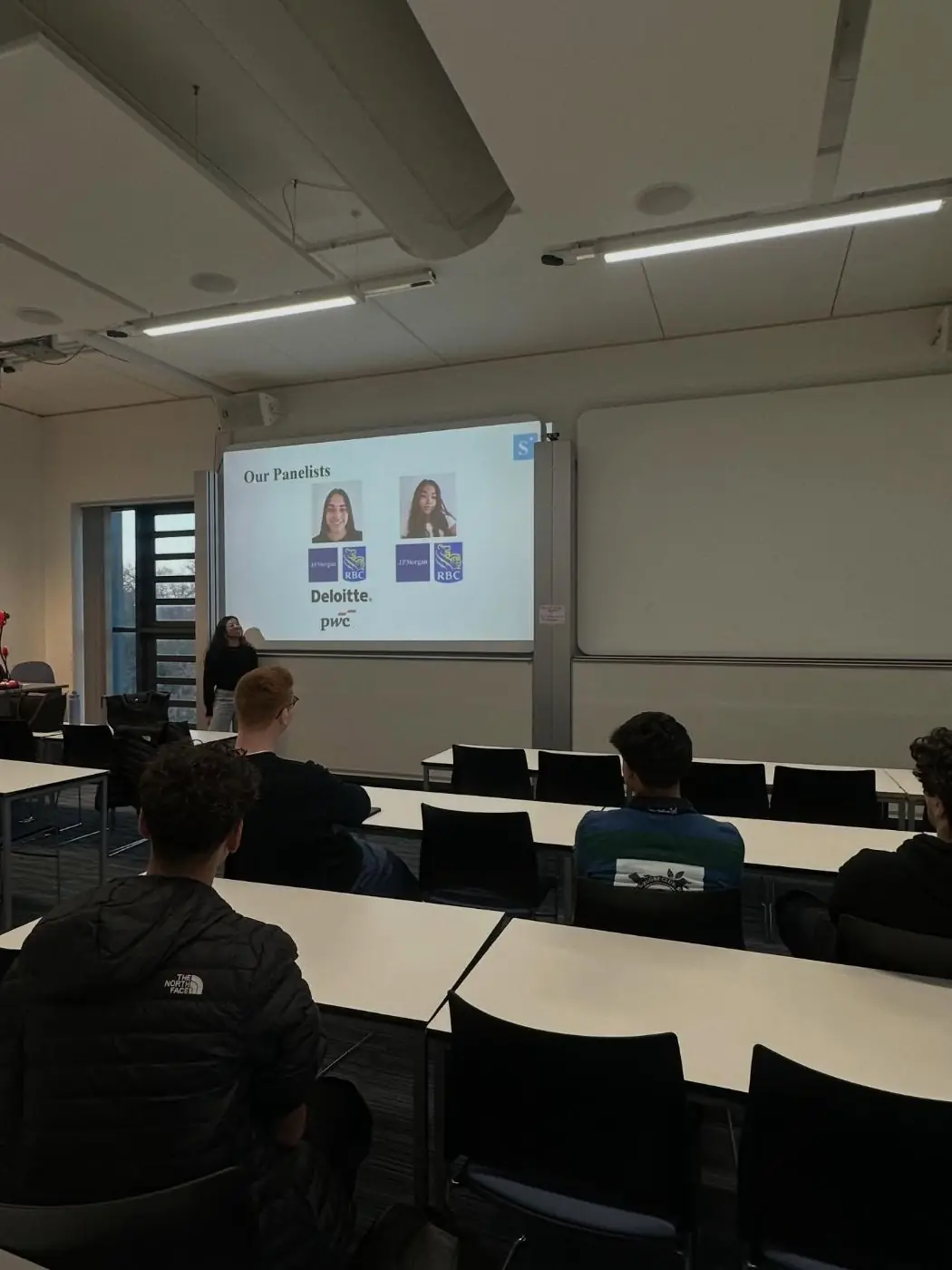 Members watching a careers panel in a lecture theatre