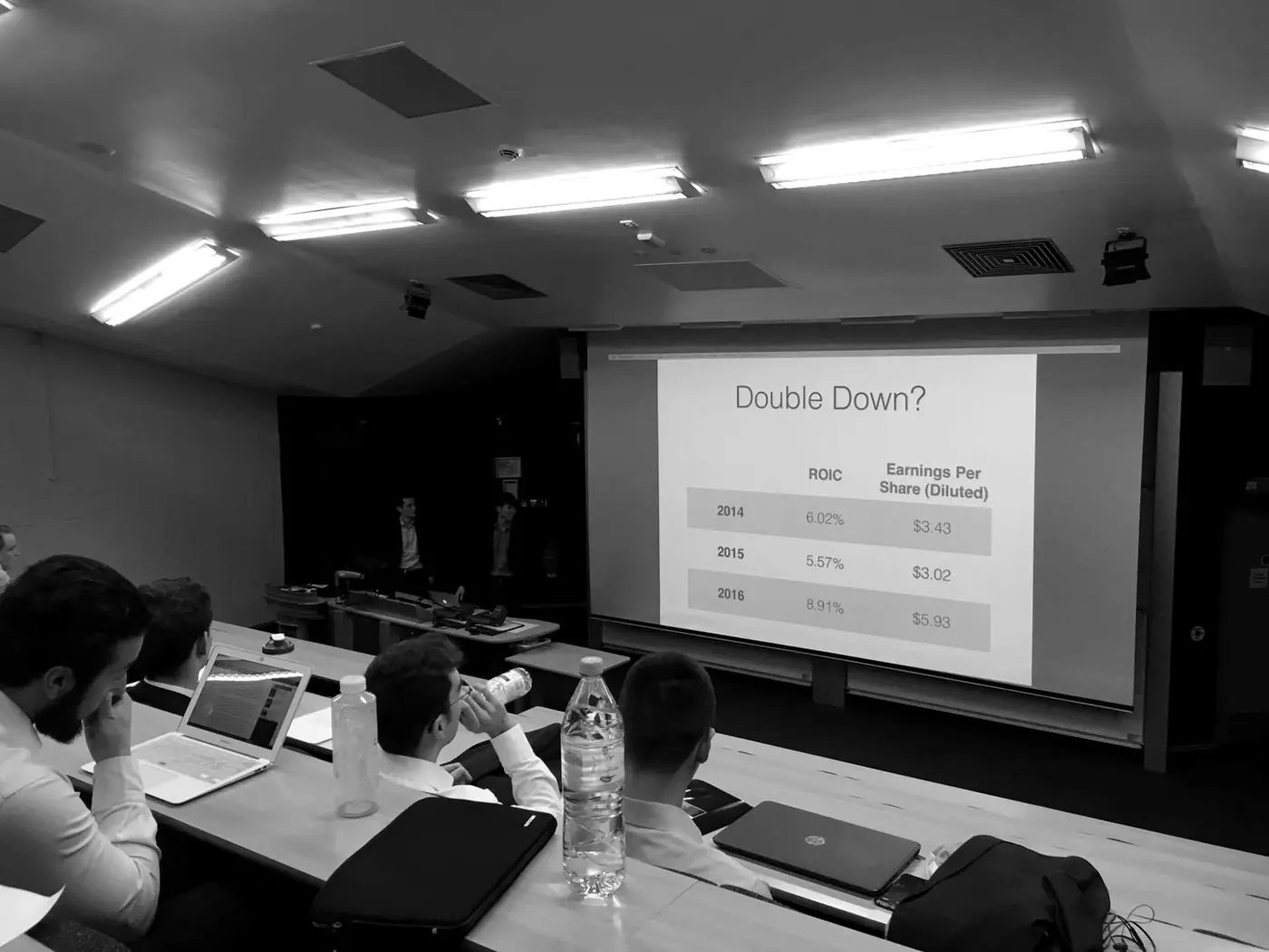 Black and white photo of a SOBIC stock pitch, with a slide titled Double Down?
